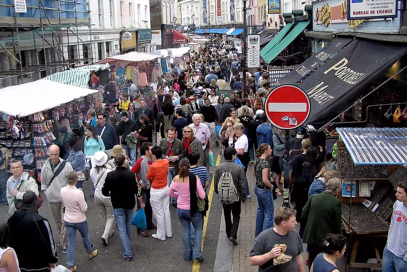 Stalls and visitors on Portobello Road Market
